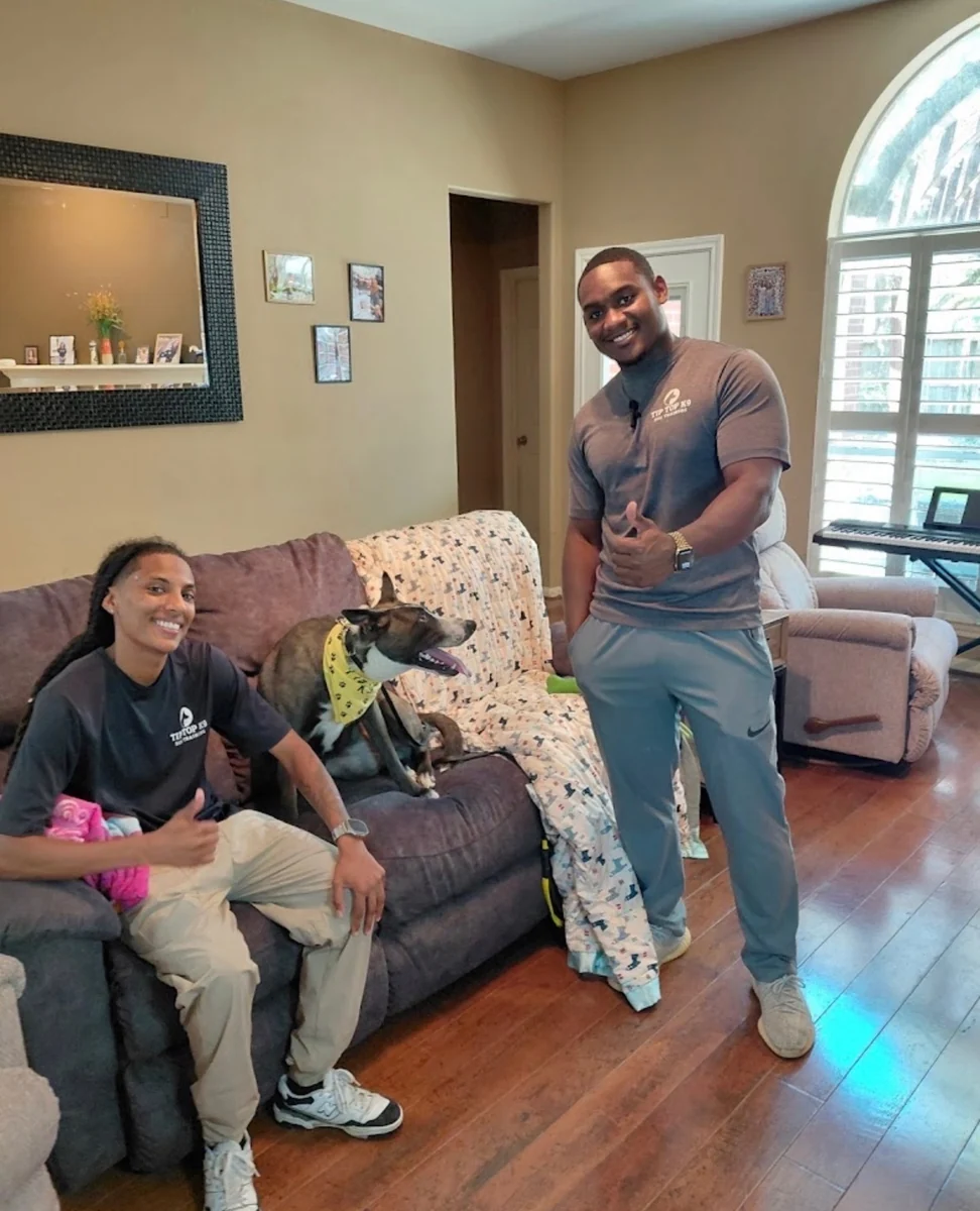 Tip Top K9 Humble trainers working a client's dog through in-home training near Humble